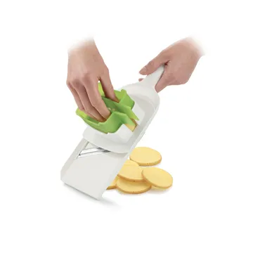 SLICER WITH MULTIFUNCTIONAL HOLDER