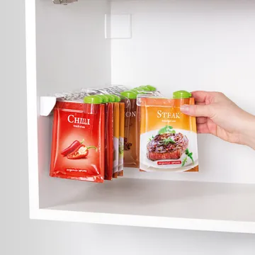 DISPENSING CLOSURES FOR SPICE BAGS, ON SUSPENSION BAR