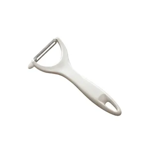 PEELER WITH LATERAL BLADE